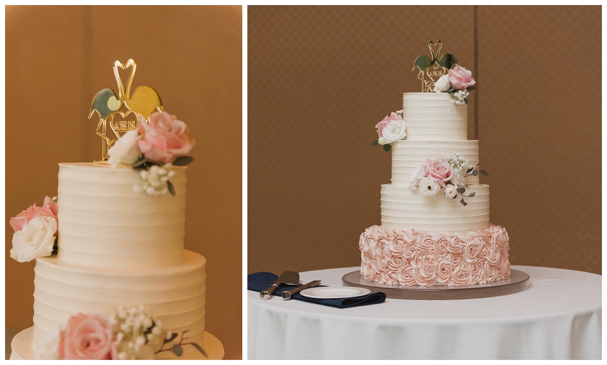 four tier wedding cake, bottom tier pink icing roses, upper tiers smooth white icing, with a mirrored flamingo topper, wedding photography by Sandra Grunzinger Photography