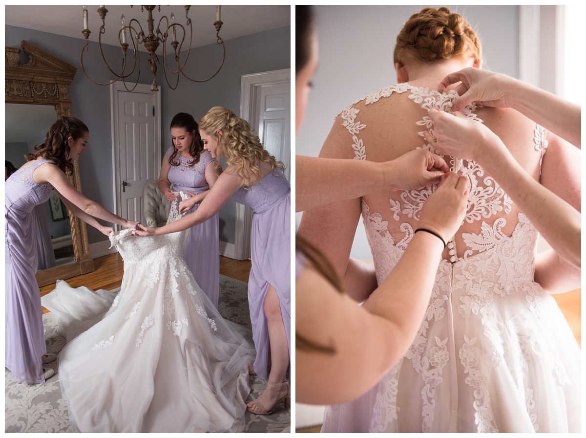 bridesmaids in lilac purple dresses helping bride into dress at Stone House of St Charles, a St Louis wedding venue